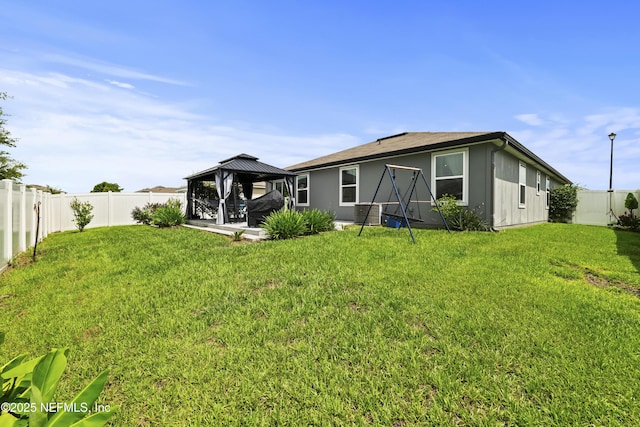 2264 Pebble Point Dr, Green Cove Springs, FL 32043 - back of property featuring a gazebo, a fenced backyard, and a patio