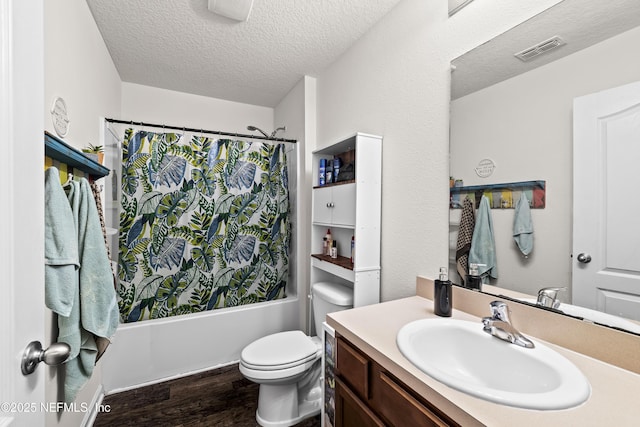 2264 Pebble Point Dr, Green Cove Springs, FL 32043 - full bath with wood finished floors, vanity, a textured ceiling, and shower / bath combo with shower curtain