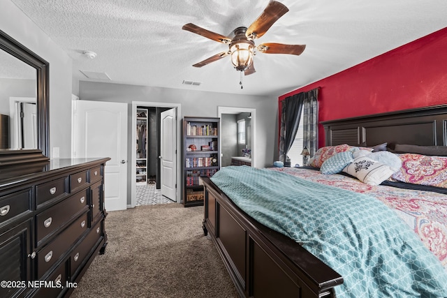 2264 Pebble Point Dr, Green Cove Springs, FL 32043 - bedroom with carpet floors, a textured ceiling, ceiling fan, and ensuite bath