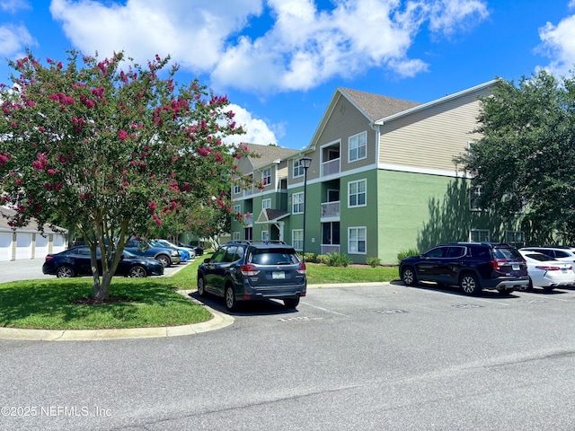 7701 Timberlin Park Blvd Unit 322, Jacksonville, FL 32256 - view of property with uncovered parking