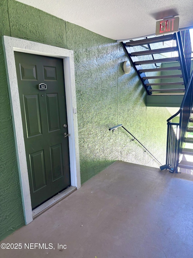 7701 Timberlin Park Blvd Unit 322, Jacksonville, FL 32256 - doorway to property with stucco siding