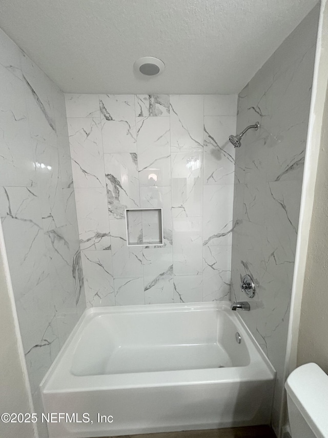 7701 Timberlin Park Blvd Unit 322, Jacksonville, FL 32256 - bathroom with a textured ceiling and shower / bath combination