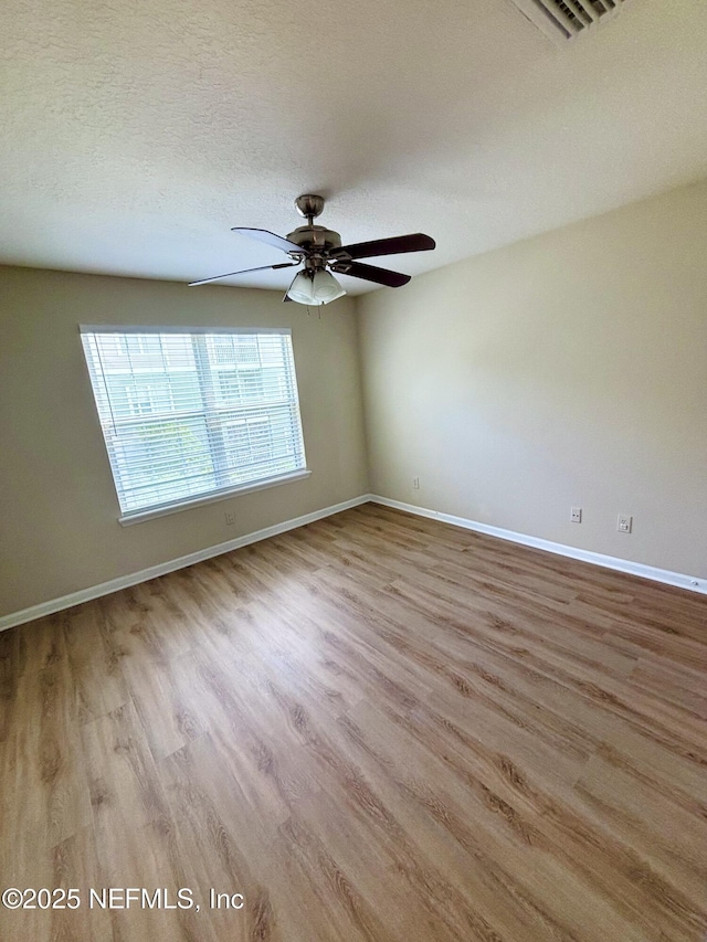 7701 Timberlin Park Blvd Unit 322, Jacksonville, FL 32256 - unfurnished room with wood finished floors and a ceiling fan