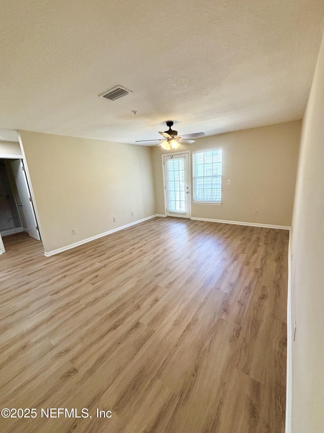 7701 Timberlin Park Blvd Unit 322, Jacksonville, FL 32256 - spare room with light wood-style flooring and ceiling fan