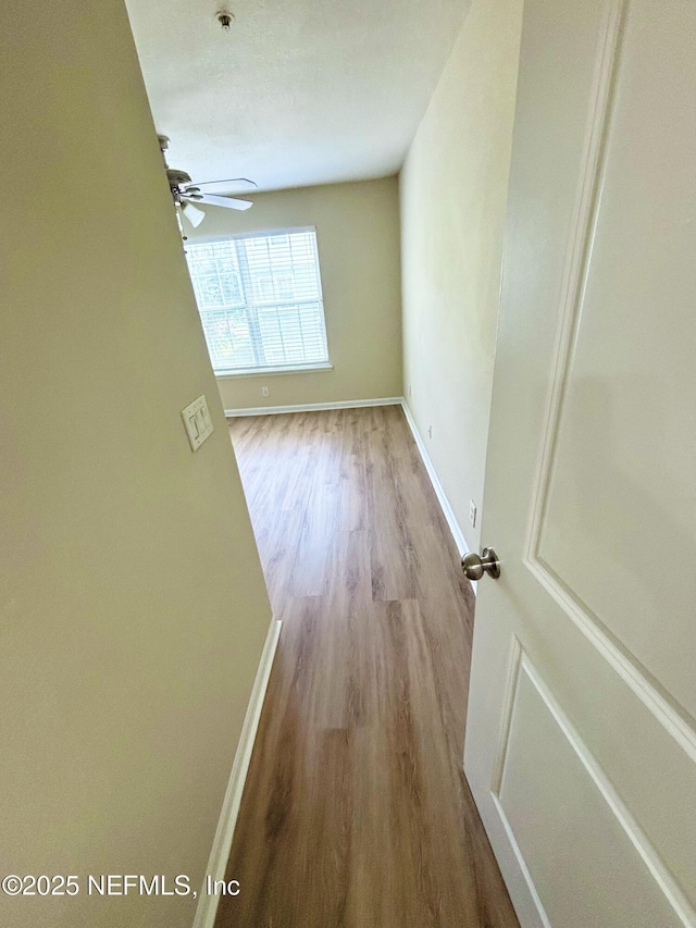 7701 Timberlin Park Blvd Unit 322, Jacksonville, FL 32256 - empty room with wood finished floors and a ceiling fan