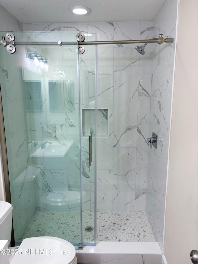 7701 Timberlin Park Blvd Unit 322, Jacksonville, FL 32256 - bathroom with a marble finish shower and recessed lighting
