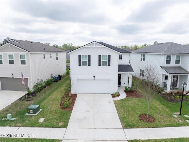 143 Dahlia Falls Dr, Saint Johns, FL 32259 - view of front of house with board and batten siding, a garage, driveway, and a front lawn