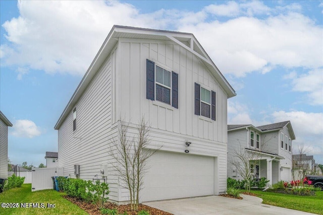 143 Dahlia Falls Dr, Saint Johns, FL 32259 - modern inspired farmhouse featuring board and batten siding, concrete driveway, and an attached garage