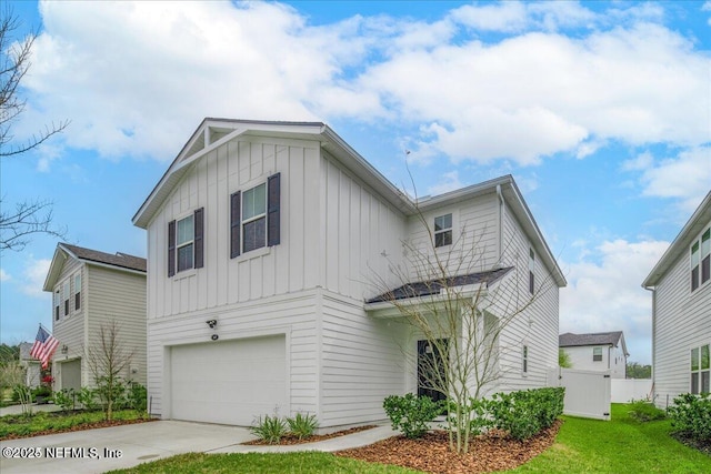 143 Dahlia Falls Dr, Saint Johns, FL 32259 - view of front of house featuring board and batten siding, a garage, and driveway