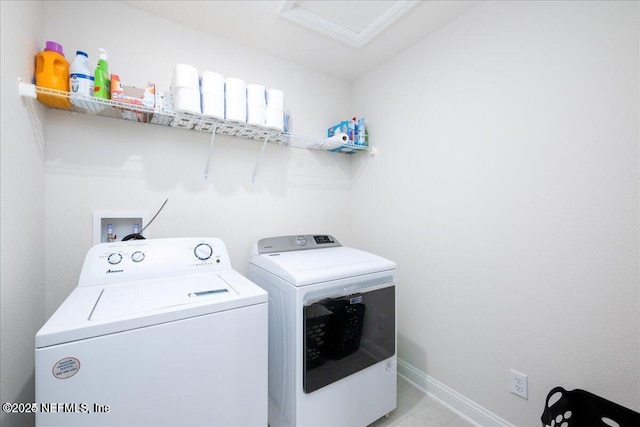 143 Dahlia Falls Dr, Saint Johns, FL 32259 - laundry area featuring washing machine and clothes dryer and attic access