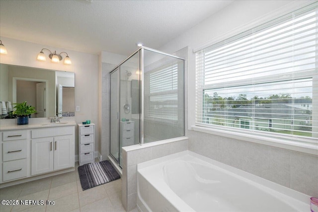 143 Dahlia Falls Dr, Saint Johns, FL 32259 - full bathroom with a garden tub, vanity, a stall shower, tile patterned flooring, and a textured ceiling