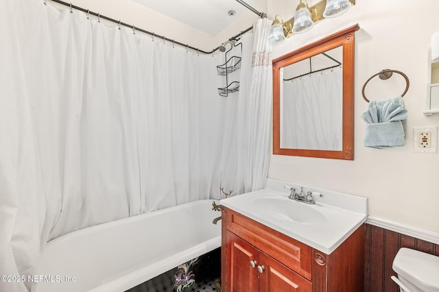 122 Twine St, Saint Augustine, FL 32084 - bathroom featuring vanity, shower / tub combo, and a wainscoted wall