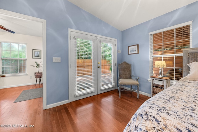 122 Twine St, Saint Augustine, FL 32084 - bedroom featuring vaulted ceiling, access to exterior, french doors, wood finished floors, and multiple windows