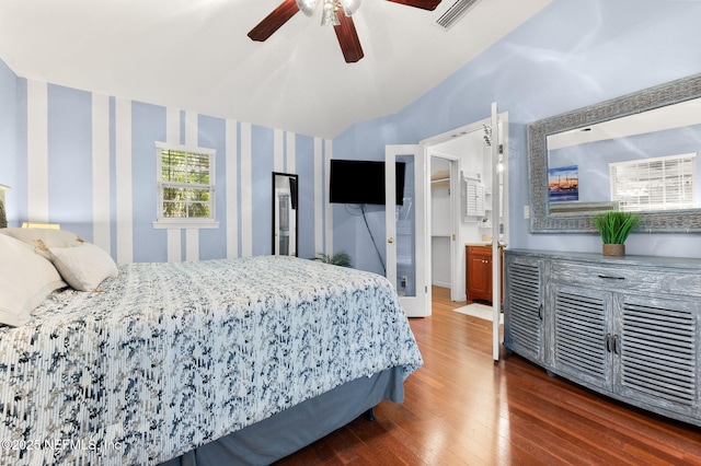 122 Twine St, Saint Augustine, FL 32084 - bedroom with wood finished floors, lofted ceiling, ceiling fan, and wallpapered walls