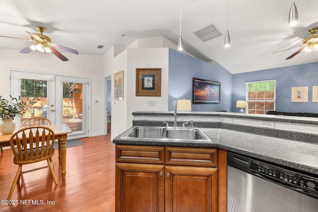 122 Twine St, Saint Augustine, FL 32084 - kitchen featuring dishwasher, a ceiling fan, lofted ceiling, wood finished floors, and brown cabinets