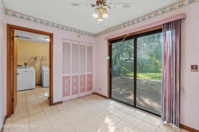 1083 Kings Rd, Neptune Beach, FL 32266 - empty room with washing machine and clothes dryer, light tile patterned flooring, and ceiling fan