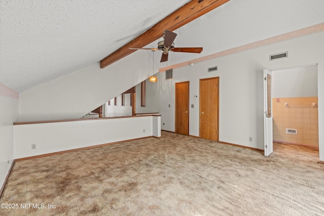 1083 Kings Rd, Neptune Beach, FL 32266 - unfurnished living room with ceiling fan, carpet, and a textured ceiling