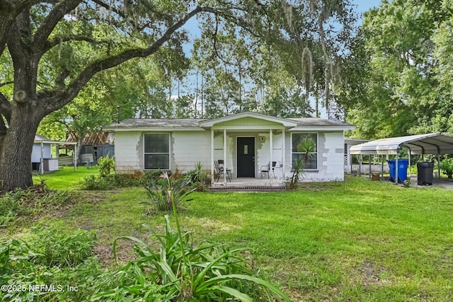 2259 Marlee Rd S, Jacksonville, FL 32259 - view of front of home featuring a front yard, a carport, and covered porch