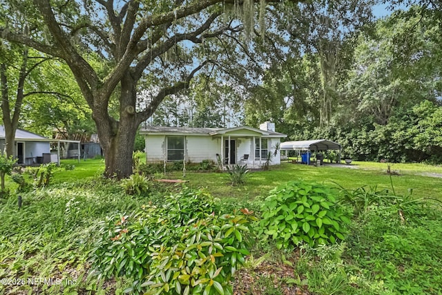 2259 Marlee Rd S, Jacksonville, FL 32259 - view of green lawn with a carport