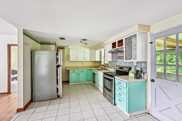 2259 Marlee Rd S, Jacksonville, FL 32259 - kitchen with appliances with stainless steel finishes, under cabinet range hood, light countertops, backsplash, and light tile patterned floors