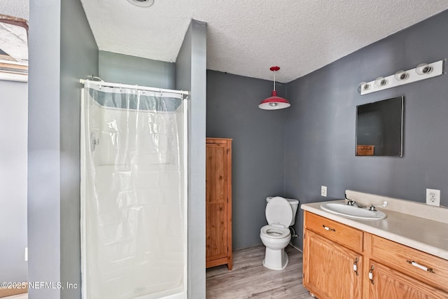 2259 Marlee Rd S, Jacksonville, FL 32259 - full bath with wood finished floors, vanity, a shower with curtain, and a textured ceiling