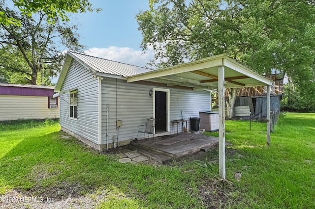 2259 Marlee Rd S, Jacksonville, FL 32259 - rear view of property with a yard and a metal roof