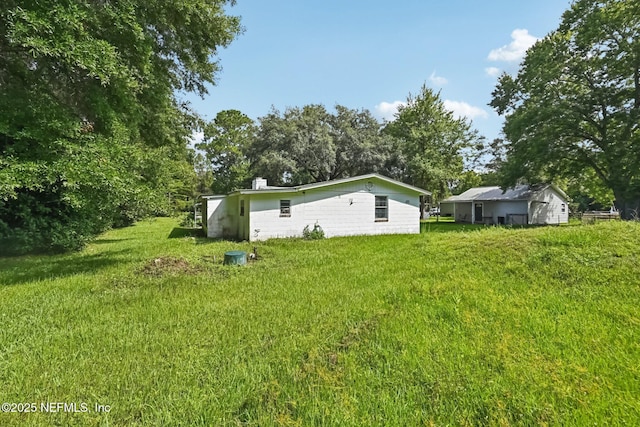 2259 Marlee Rd S, Jacksonville, FL 32259 - rear view of house featuring a lawn