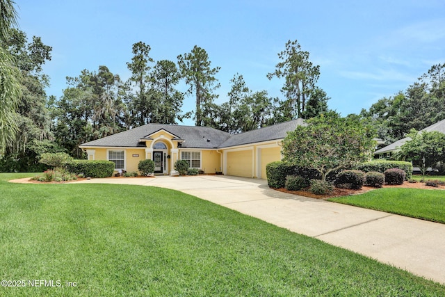 1994 Protection Pt, Fleming Island, FL 32003 - ranch-style home with an attached garage, a front yard, driveway, and stucco siding