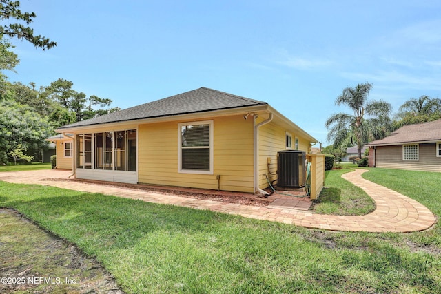 1994 Protection Pt, Fleming Island, FL 32003 - rear view of property with a yard, roof with shingles, and a sunroom