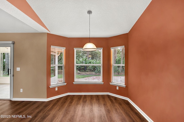 1994 Protection Pt, Fleming Island, FL 32003 - unfurnished dining area featuring dark wood-style floors and a textured ceiling