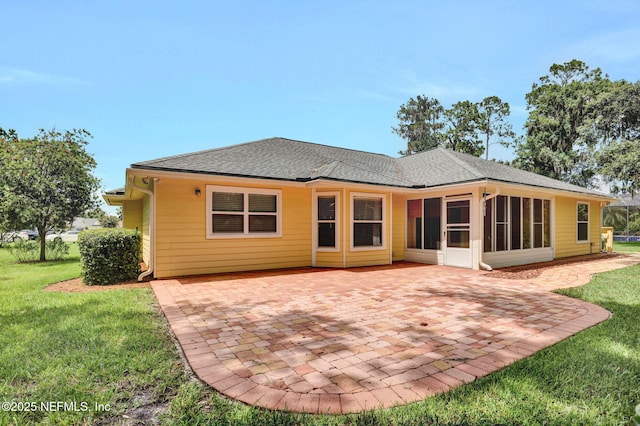 1994 Protection Pt, Fleming Island, FL 32003 - back of property with a patio area, a lawn, a shingled roof, and a sunroom