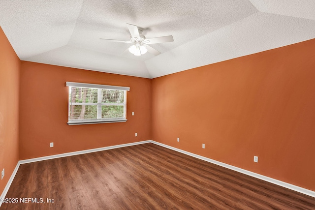 1994 Protection Pt, Fleming Island, FL 32003 - empty room with dark wood-style floors, a ceiling fan, a textured ceiling, and lofted ceiling