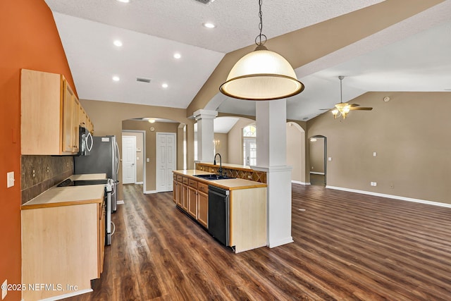 1994 Protection Pt, Fleming Island, FL 32003 - kitchen featuring arched walkways, stainless steel appliances, ornate columns, lofted ceiling, and a ceiling fan