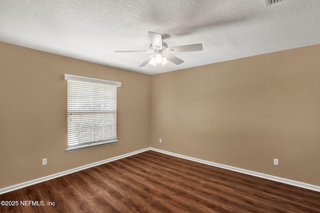 1994 Protection Pt, Fleming Island, FL 32003 - unfurnished room featuring dark wood finished floors, ceiling fan, and a textured ceiling
