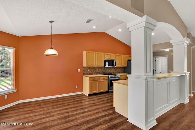 1994 Protection Pt, Fleming Island, FL 32003 - kitchen with stainless steel electric range oven, ornate columns, lofted ceiling, arched walkways, and dark wood finished floors