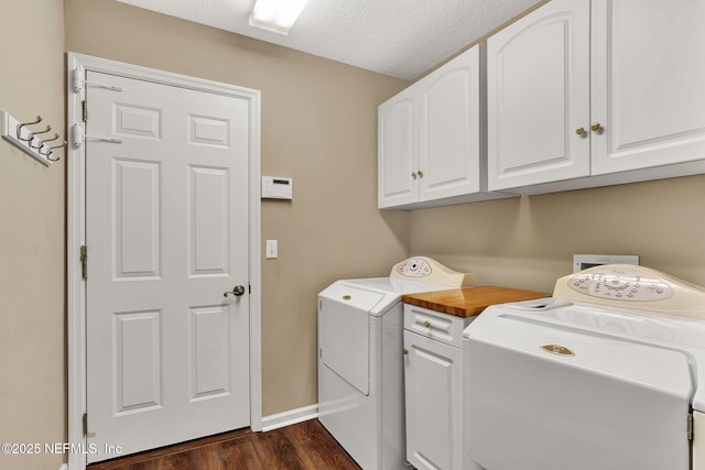 1994 Protection Pt, Fleming Island, FL 32003 - laundry area featuring washer and clothes dryer, dark wood finished floors, cabinet space, and a textured ceiling