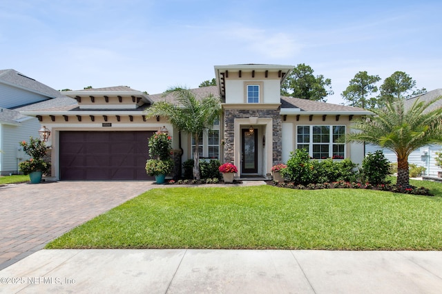95196 Golden Glow Dr, Fernandina Beach, FL 32034 - mediterranean / spanish-style home featuring stucco siding, a garage, driveway, a front lawn, and stone siding