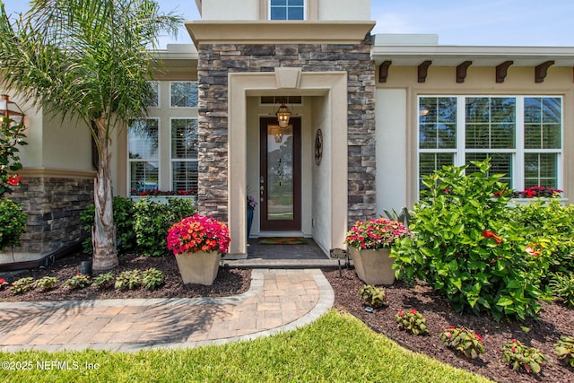 95196 Golden Glow Dr, Fernandina Beach, FL 32034 - doorway to property featuring stone siding and stucco siding