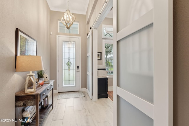 95196 Golden Glow Dr, Fernandina Beach, FL 32034 - foyer entrance featuring a chandelier and baseboards