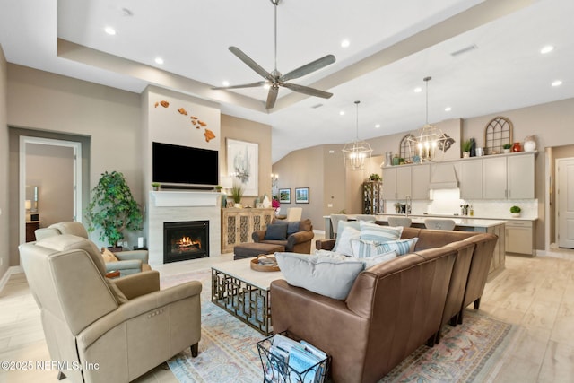 95196 Golden Glow Dr, Fernandina Beach, FL 32034 - living area featuring recessed lighting, a ceiling fan, a lit fireplace, a chandelier, and light wood finished floors