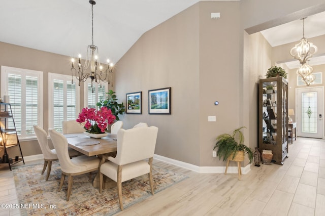 95196 Golden Glow Dr, Fernandina Beach, FL 32034 - dining space featuring a chandelier, high vaulted ceiling, and light wood-type flooring