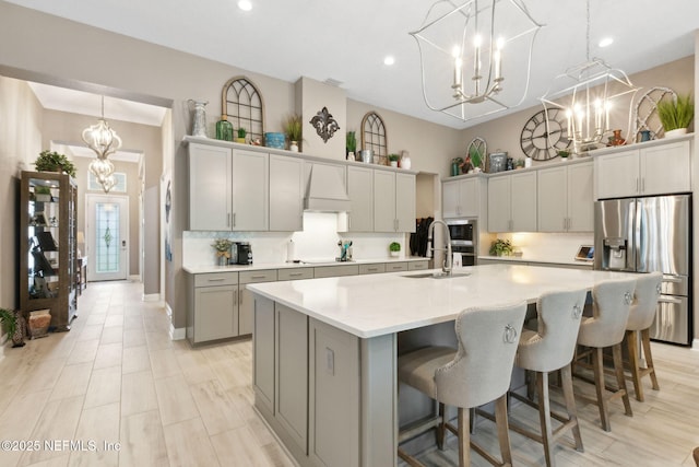 95196 Golden Glow Dr, Fernandina Beach, FL 32034 - kitchen with stainless steel appliances, a chandelier, light countertops, a large island, and backsplash