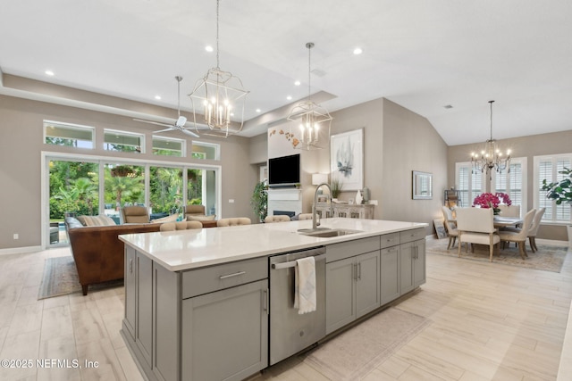 95196 Golden Glow Dr, Fernandina Beach, FL 32034 - kitchen with stainless steel dishwasher, a chandelier, gray cabinets, open floor plan, and a center island with sink