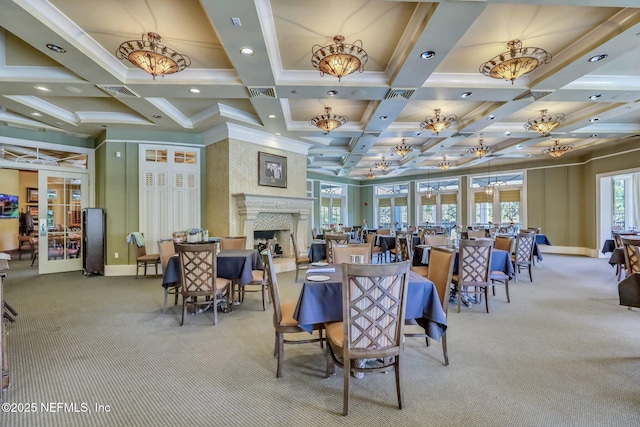 95196 Golden Glow Dr, Fernandina Beach, FL 32034 - carpeted dining area featuring coffered ceiling, beam ceiling, a large fireplace, french doors, and recessed lighting