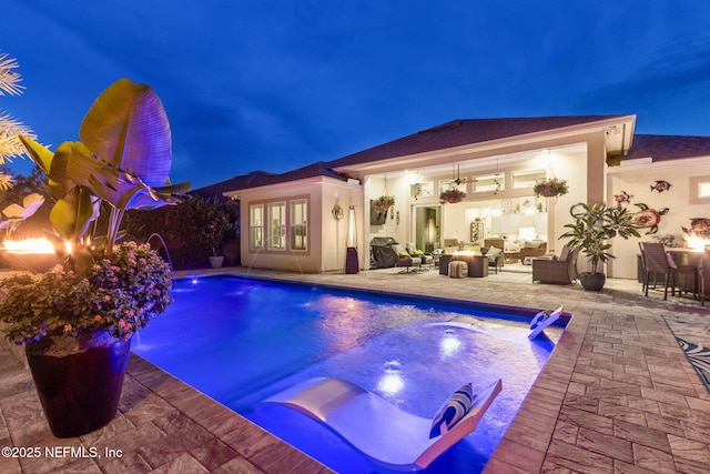 95196 Golden Glow Dr, Fernandina Beach, FL 32034 - pool at twilight with an outdoor pool, a patio area, and outdoor lounge area