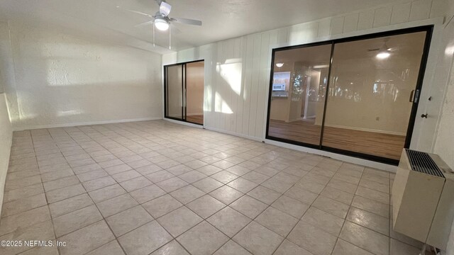 2664 SW 14th Dr Unit 325, Gainesville, FL 32608 - spare room featuring a ceiling fan and light tile patterned floors