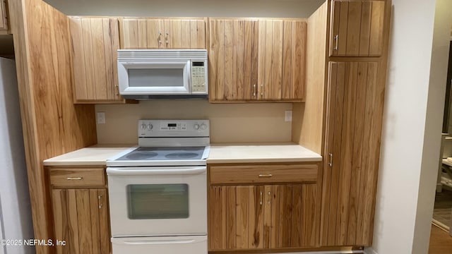 2664 SW 14th Dr Unit 325, Gainesville, FL 32608 - kitchen with white appliances and light countertops