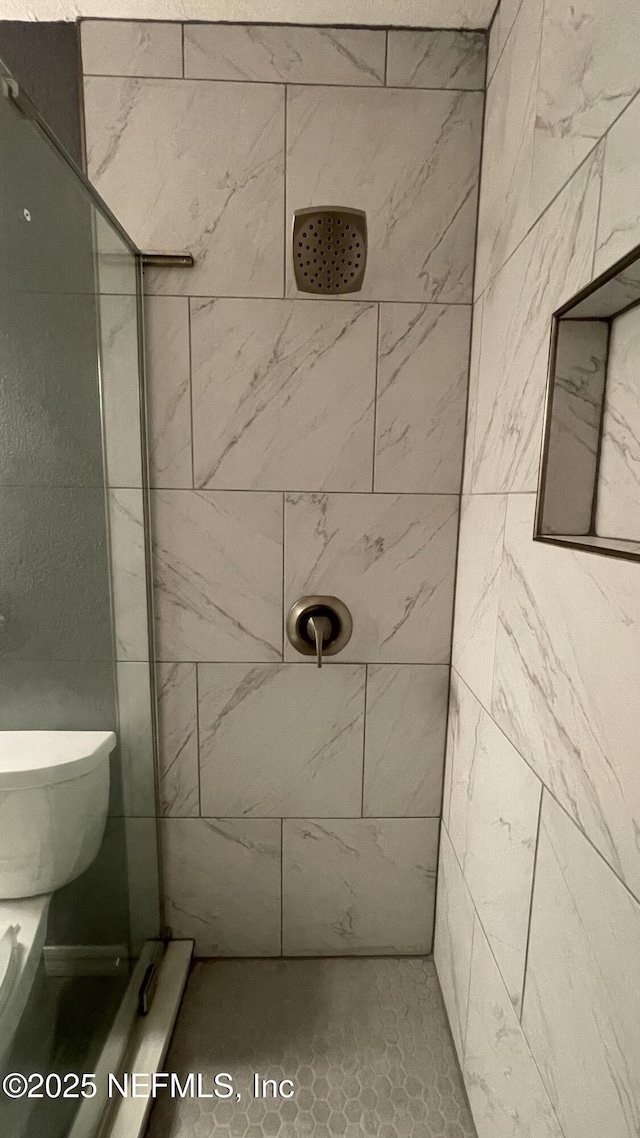2664 SW 14th Dr Unit 325, Gainesville, FL 32608 - full bathroom featuring a tile shower and toilet