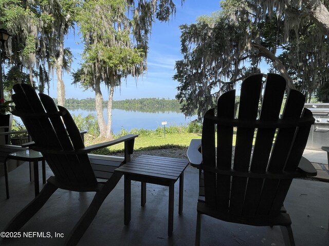 2664 SW 14th Dr Unit 325, Gainesville, FL 32608 - view of patio / terrace featuring a water view