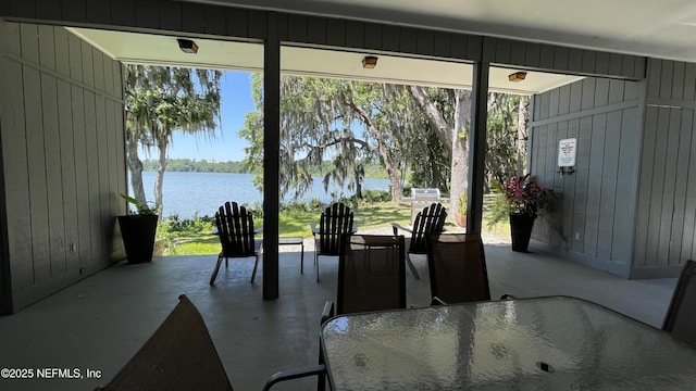 2664 SW 14th Dr Unit 325, Gainesville, FL 32608 - dining area with a water view and wooden walls